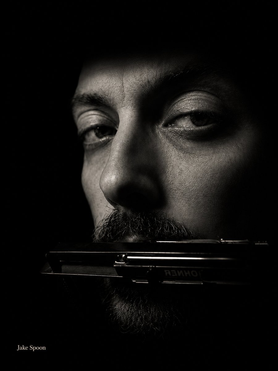 Jake Spoon with harmonica